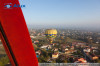 View over the city from the air balloon (the red stroke is a part of the basket frame)