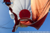 The envelope of the air balloon is being emptied of some of its air